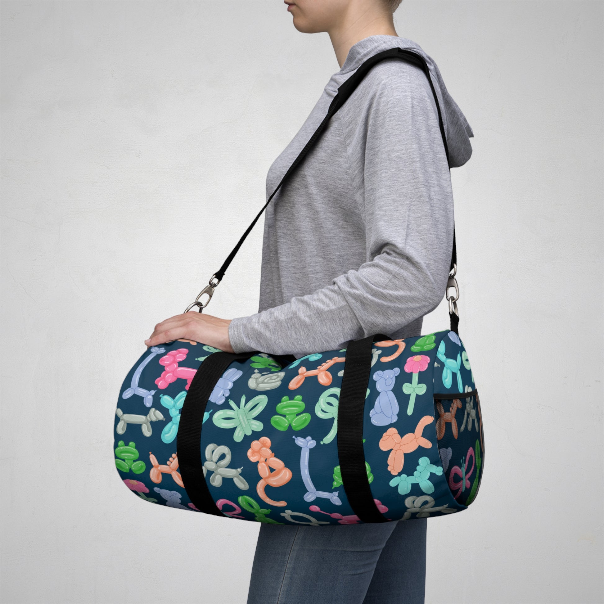 Woman Carrying Duffle Bag with Balloon Animals